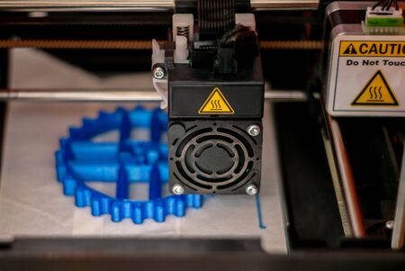 Perm, Russia - June 14, 2019: 3D printer printhead during printing volume detail in close-up with...