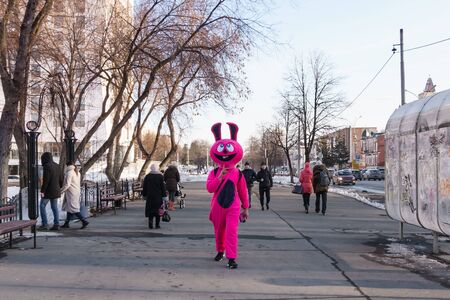 Perm, Russia - March 16, 2019: promoter dressed as a dreamy pink hare walking down the streetのeditorial素材