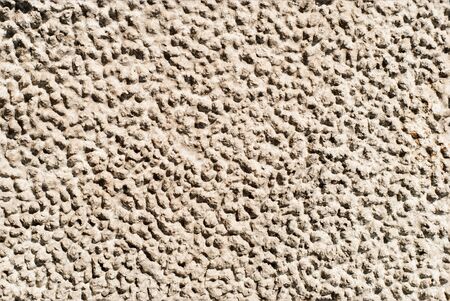 seamless texture - gray rough dried clay with traces of raindropsの写真素材