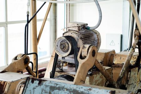 fragment of an old conche machine with electric motor in the shop of a confectionery factoryの写真素材