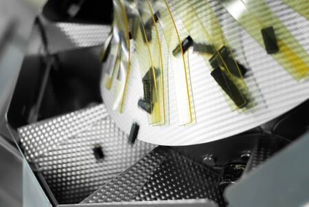 motion blurred rotating part of a packaging machine in a confectionery factoryの写真素材