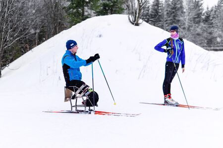 Perm, Russia - December 07, 2019: athlete skier with disability warming up outdoors in winterのeditorial素材