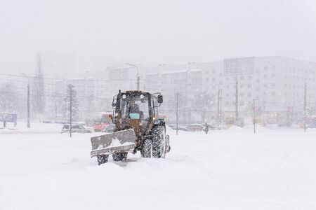 Perm, Russia - December 24, 2019: snow removal works by road equipment during extreme snowfallのeditorial素材