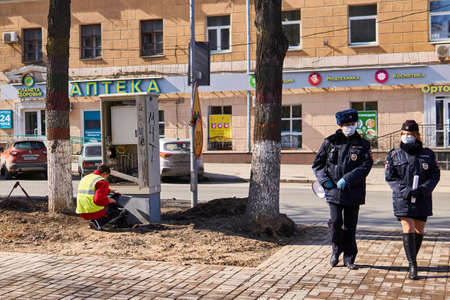 Perm, Russia - April 15, 2020: police and repair services continue to work on empty streets during quarantine due to the coronavirus pandemicのeditorial素材