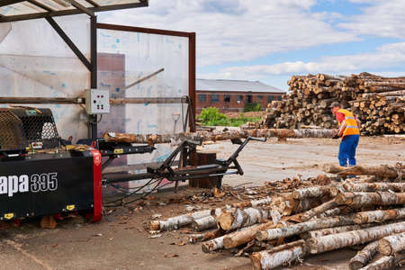 Perm, Russia - May 29, 2020: modern firewood processor in operation