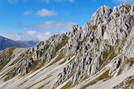 beautiful alpine landscape with peaked rocks on the ridgeの写真素材