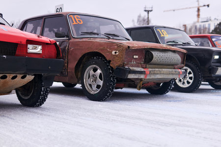 Perm, Russia - January 26, 2020: cars equipped for tough races stand at the start before an amateur...