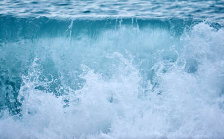 background - sea surf in cloudy day, breaking wave close-up