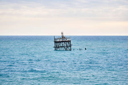 seascape with a rickety structure on the stilts of an mariculture farmの写真素材