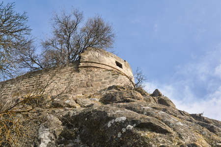 view of the ruins of a medieval fortress on a rocky hilltopのeditorial素材