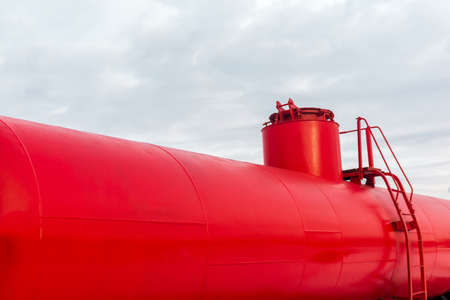 red railway tank car close up against the skyの写真素材