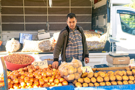 Kemer, Turkey - November 08, 2021: vegetable merchant at a local bazaarのeditorial素材
