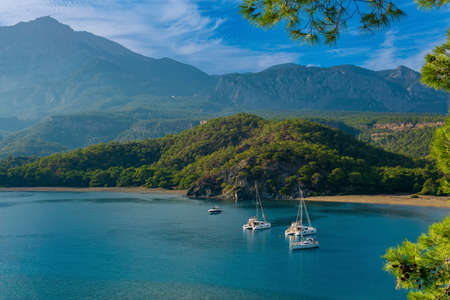 sea bay among the mountains with some yachts, the former South Harbor of the antique city of...