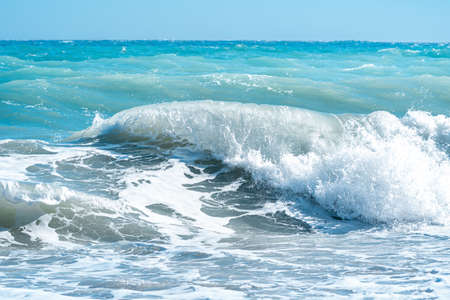sea surf on the beach close-up, waves and foam