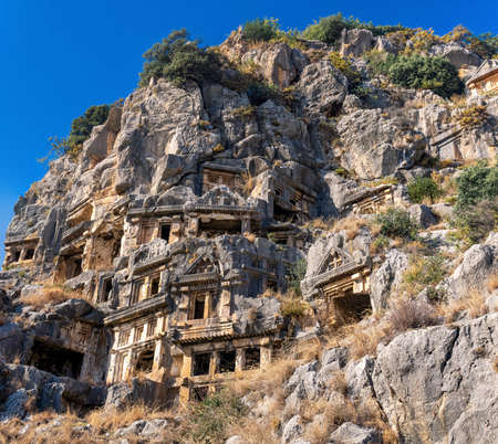 ancient tombs carved into the rocks in the ruins of Myra of Lycia