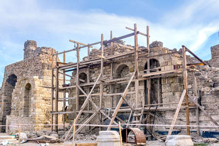 wooden scaffolding around a restored antique buildingの写真素材