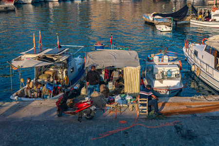Antalya, Turkey - November 15, 2021: fishermen on the pier in the old city harborのeditorial素材