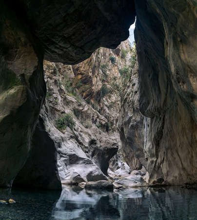 huge stone hangs stuck between two walls of the Goynuk canyon in Turkeyの写真素材