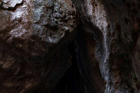 walls of a narrow canyon close, forming the vaults of the cave