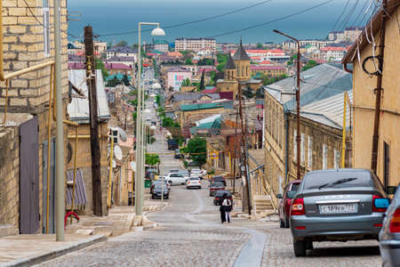 Derbent, Russia - May 09, 2022: street in the historical center of Derbent on a mountain slope...