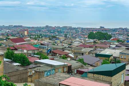 Derbent, Russia - May 09, 2022: top view of the historical quarters magals and the Caspian Sea in the distance from the wall of the citadel to the city of Derbentのeditorial素材