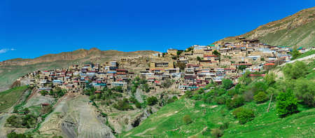 panorama of the entire ancient mountain village Chokh on a rocky slope in Dagestan