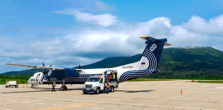 Mendeleevo, Russia - July 29, 2022: unloading luggage from the plane of the airline Aurora at the...