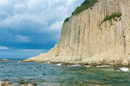 coast of Kunashir Island with columnar basalt cliff, Cape Stolbchatyの写真素材