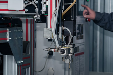 Perm, Russia - September 21, 2022: industrial robotic dosing dispenser machine, dispensing system robot before workのeditorial素材