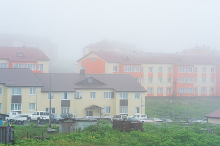Yuzhno-Kurilsk, Russia - August 03, 2022: view of the village of Yuzhno-Kurilsk on the island of Kunashir during fogのeditorial素材