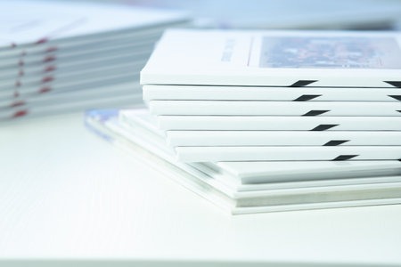 stack of freshly printed photobooks on the table close-up
