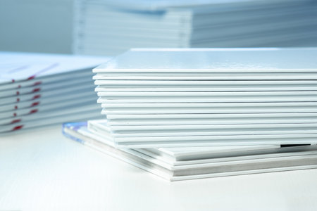 stack of photo books close-up, partial blurの写真素材