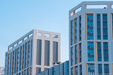 cityscape, urban background, group of facades of modern high-rise buildings against the skyの写真素材