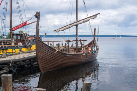 Petrozavodsk, Russia - July 30b 2023: modern replicas of old sailing ships are moored on the pier near the shore of Lake Onegaのeditorial素材