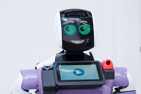 Perm, Russia - July 13, 2023: friendly humanoid robot guide expressing emotionsのeditorial素材