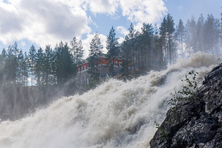 waterfall during opened locks for idle discharge of water at a small hydroelectric power stationの写真素材