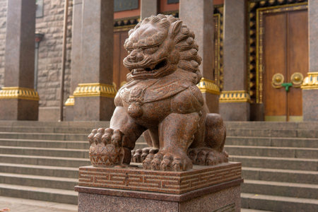 Saint Petersburg, Russia - August 01, 2023: stone statue of a lion at the entrance to the Buddhist Datsan Gunzechoineiのeditorial素材