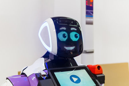 Perm, Russia - July 13, 2023: friendly humanoid robot guide expressing emotionsのeditorial素材