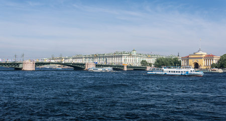 Saint Petersburg, Russia - June 04, 2024: panoramic view of Winter Palace behind the Palace bridge, Admiralty and Neva river in summerのeditorial素材