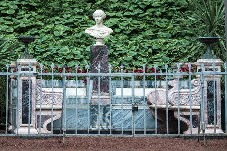 Saint Petersburg, Russia - June 06, 2024: Statue of a woman in the garden with a natural background, monument to Grand Princess Alexandra Nikolaevna in Peterhof Parkのeditorial素材