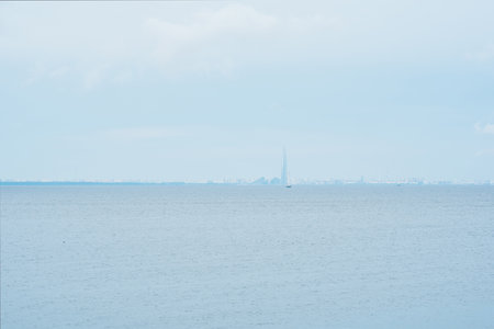 foggy seascape, natural background, view of the Gulf of Finland in rainy weather, Saint Petersburg is visible on the horizonの写真素材