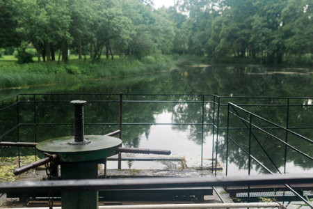 vintage lock gate valve on a pond in the parkの写真素材