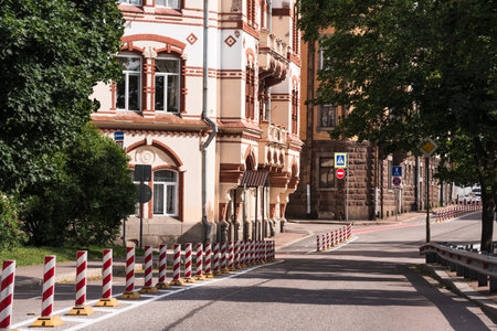 cityscape, modern street with road and bike path among historical buildingsの写真素材
