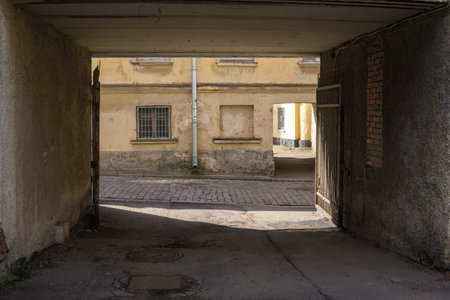 urban background, view from the gateway to the ancient streetの写真素材