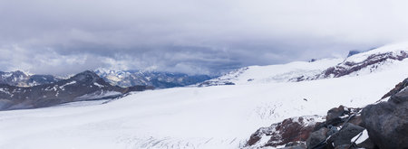 panoramic view of the slope of Mount Elbrus above the snow lineの写真素材