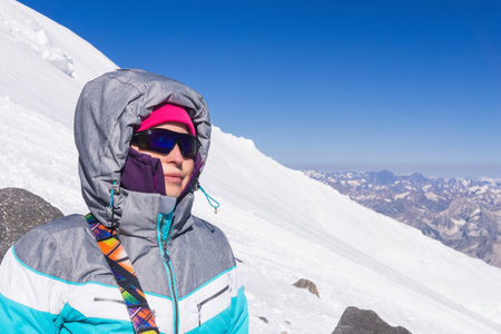 female mountaineer on the snowy slope of Mount Elbrus