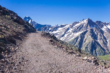 rocky dirt road through a pass in the highlandsの写真素材