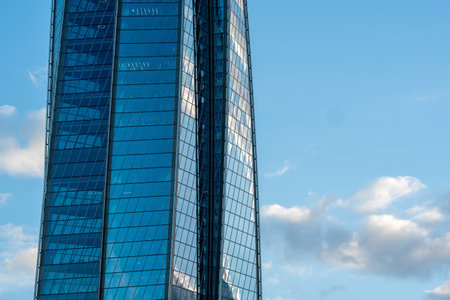 modern architecture, glass facade element of skyscraper against evening sky