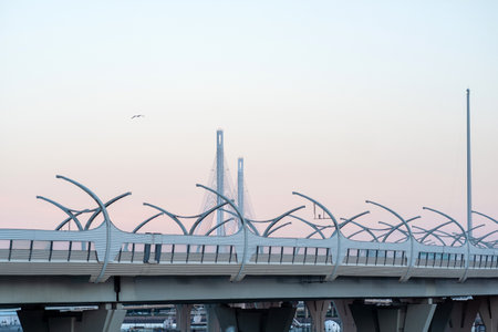urban background with a fragment of a high-speed automobile overpass on the background of a bridgeの写真素材