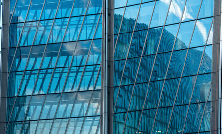 modern architectural background, glass and metal facade of contemporary buildingの写真素材